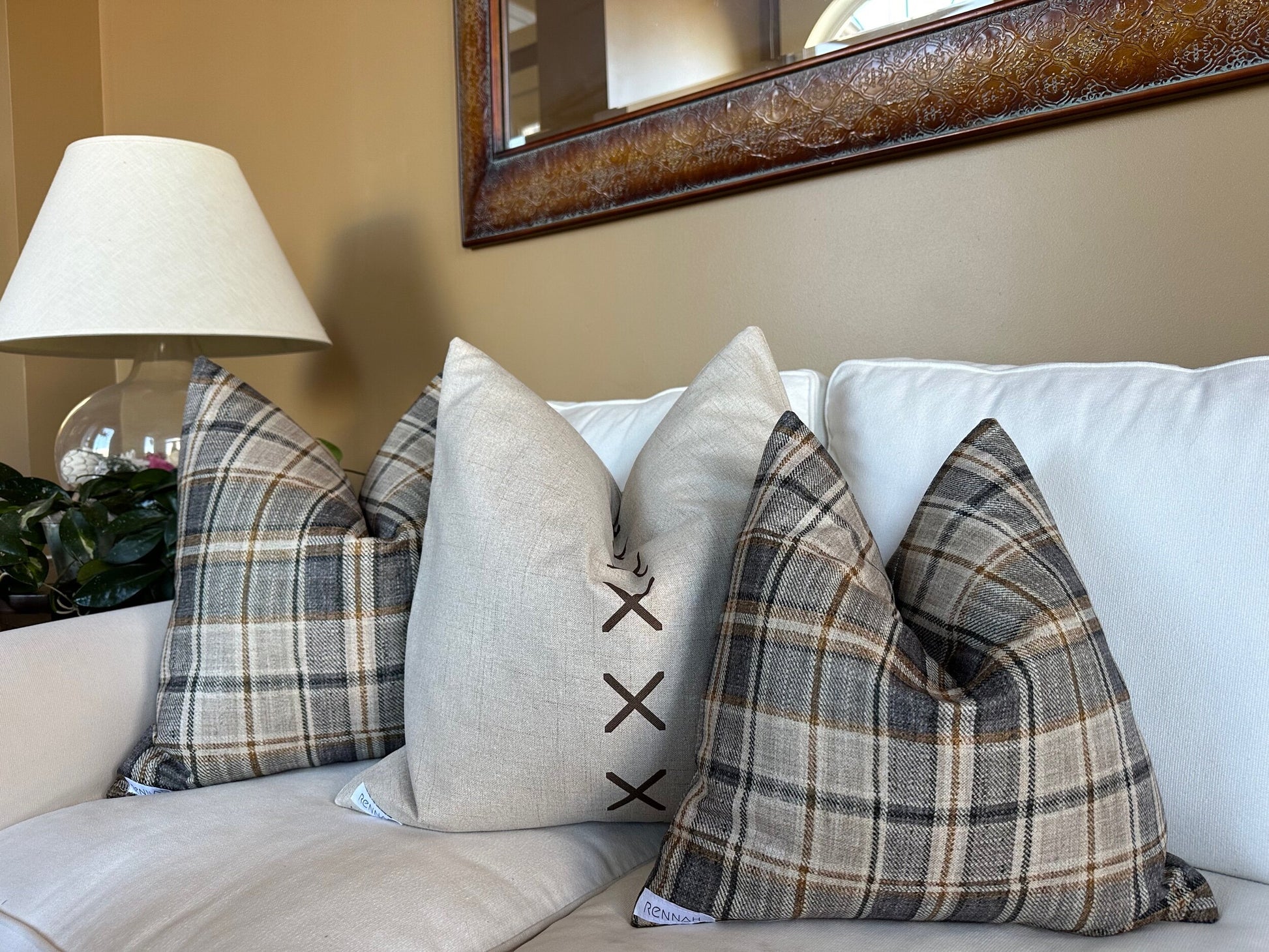 Plaid pillow in charcoal, tan, and cream with polyester-linen fabric