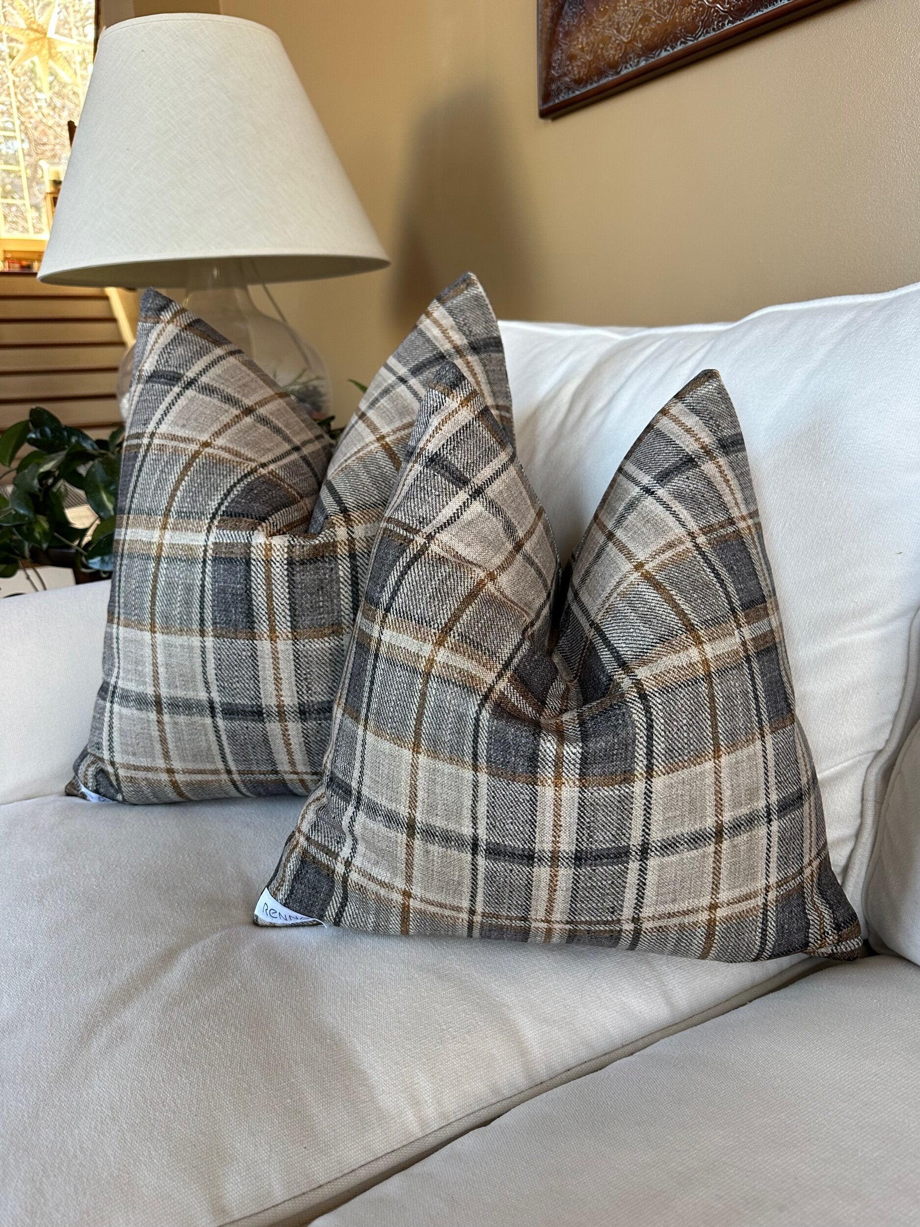 Plaid pillow in charcoal, tan, and cream with polyester-linen fabric